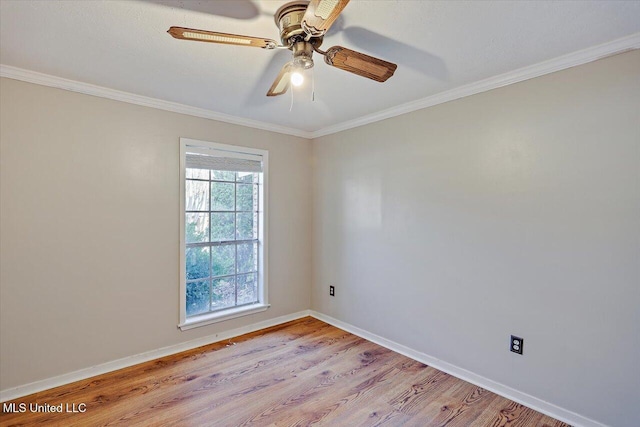 empty room with ornamental molding, light wood finished floors, a ceiling fan, and baseboards