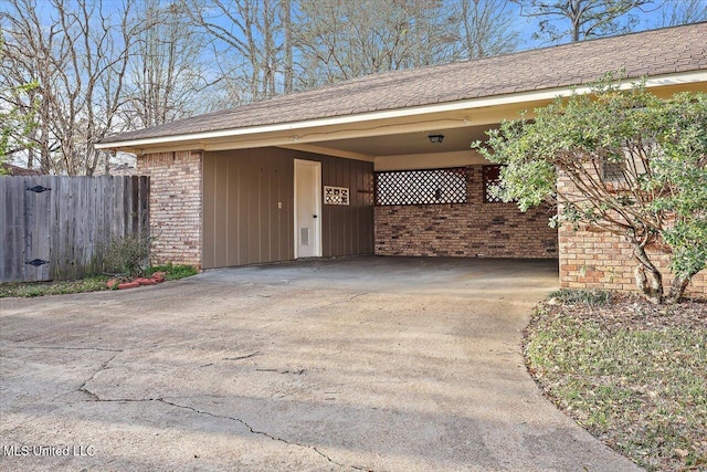 exterior space with fence and driveway