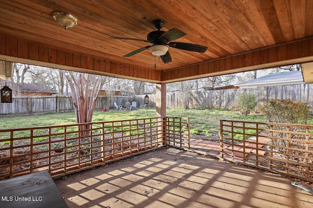 unfurnished sunroom with ceiling fan and wood ceiling