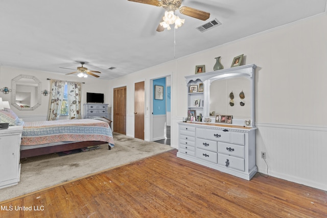 bedroom featuring hardwood / wood-style flooring and ceiling fan