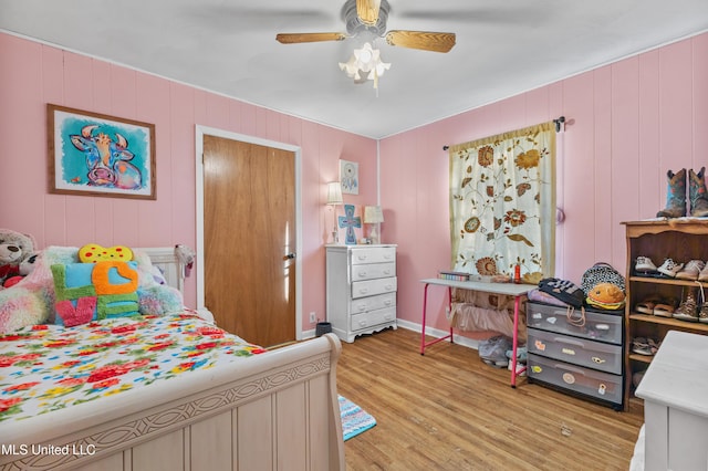 bedroom featuring ceiling fan and light hardwood / wood-style floors