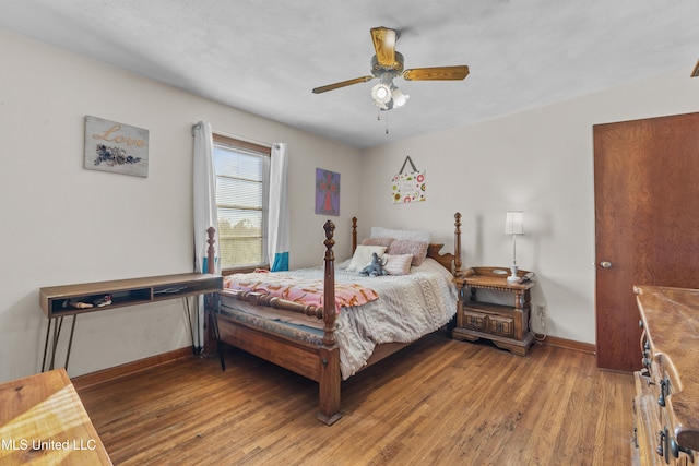 bedroom with ceiling fan and wood-type flooring