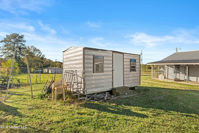 view of outdoor structure featuring a yard