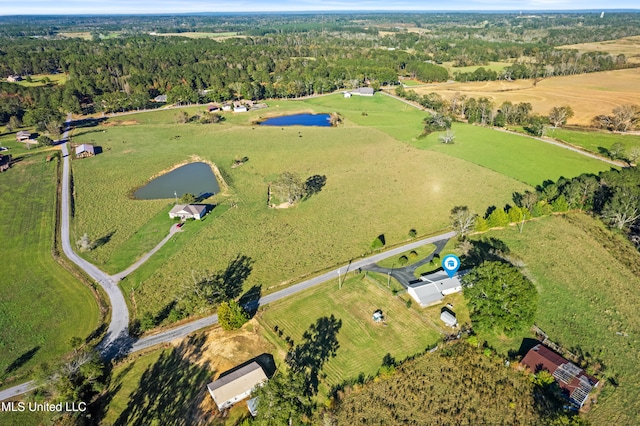 birds eye view of property with a rural view and a water view