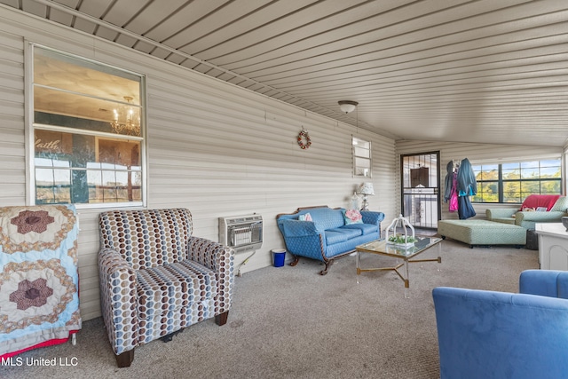 exterior space featuring carpet flooring, heating unit, wood ceiling, and lofted ceiling