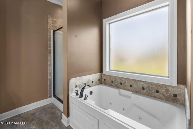 169 Beechwood Cir, Pearl, MS 39208 - full bath with a stall shower, a jetted tub, and baseboards