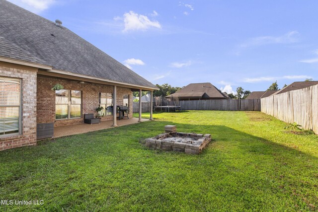 169 Beechwood Cir, Pearl, MS 39208 - view of yard featuring a trampoline and a patio area