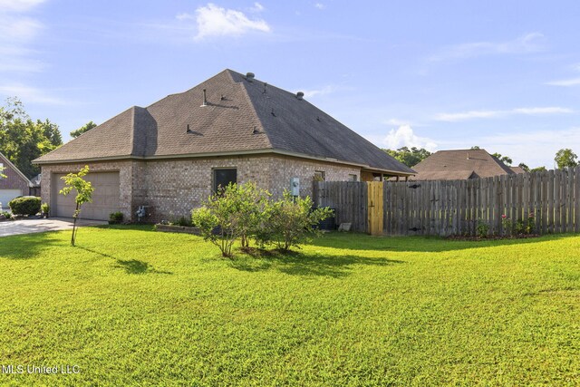 169 Beechwood Cir, Pearl, MS 39208 - view of property exterior with a shingled roof, brick siding, an attached garage, and concrete driveway