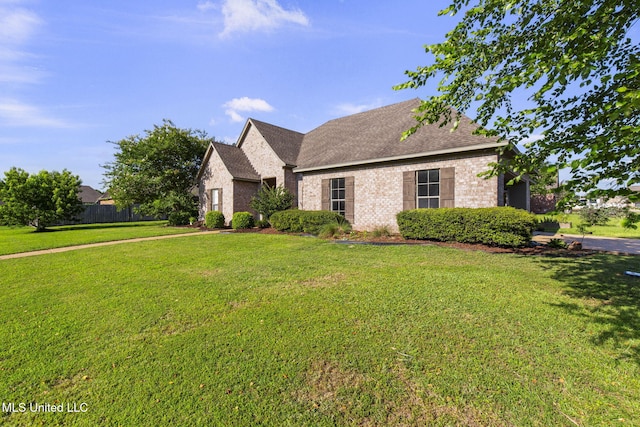 169 Beechwood Cir, Pearl, MS 39208 - view of front of house featuring brick siding, a front lawn, and a shingled roof