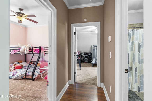 169 Beechwood Cir, Pearl, MS 39208 - hallway with ornamental molding, baseboards, dark wood-style floors, and dark carpet
