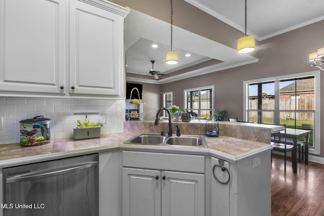 169 Beechwood Cir, Pearl, MS 39208 - kitchen featuring a sink, stainless steel dishwasher, a peninsula, healthy amount of natural light, and ornamental molding