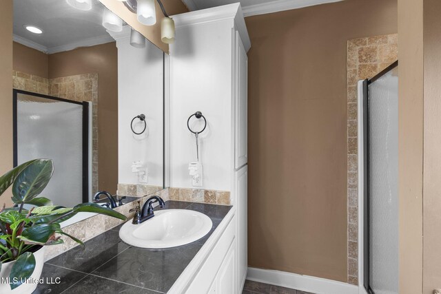 169 Beechwood Cir, Pearl, MS 39208 - full bathroom with crown molding, vanity, and a stall shower