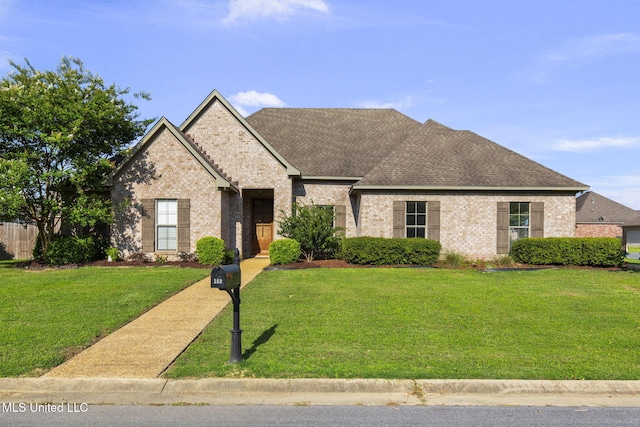 169 Beechwood Cir, Pearl, MS 39208 - view of front facade featuring brick siding, a front lawn, and roof with shingles
