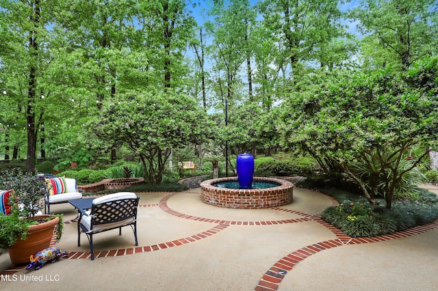 view of patio with a fire pit