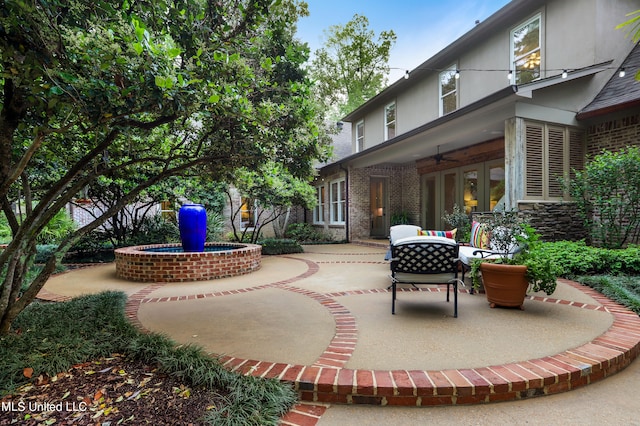 view of patio with ceiling fan