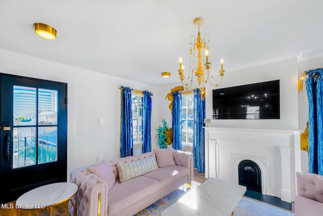 living room with a notable chandelier and ornamental molding