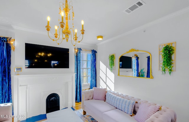 living room featuring hardwood / wood-style flooring, an inviting chandelier, and ornamental molding