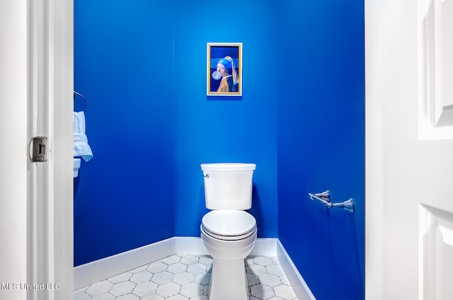 bathroom featuring tile patterned flooring and toilet