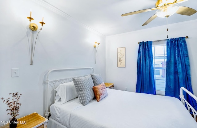 bedroom featuring ceiling fan and ornamental molding