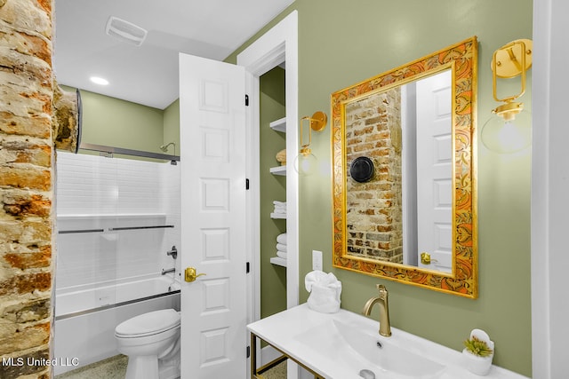 full bathroom featuring toilet, washtub / shower combination, and sink