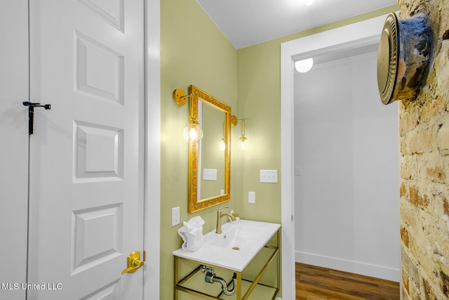 bathroom featuring hardwood / wood-style flooring and sink