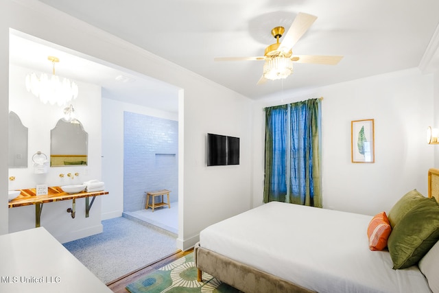 bedroom featuring ceiling fan, crown molding, carpet, and sink