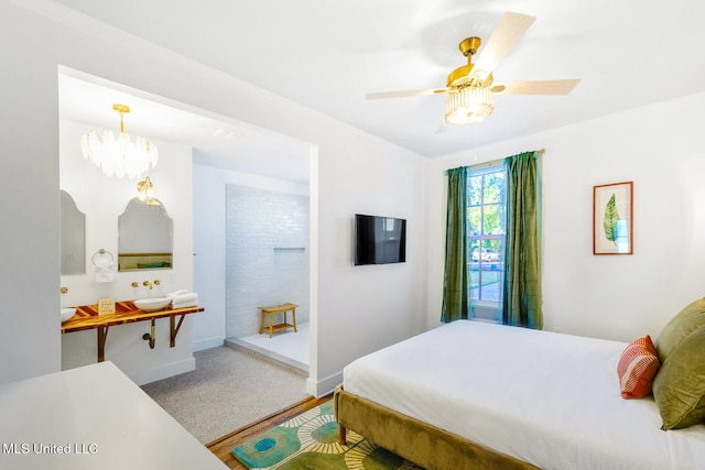 bedroom featuring ceiling fan with notable chandelier