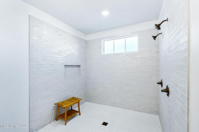 bathroom with tiled shower