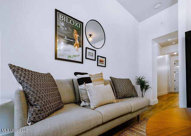 living room with wood-type flooring and lofted ceiling