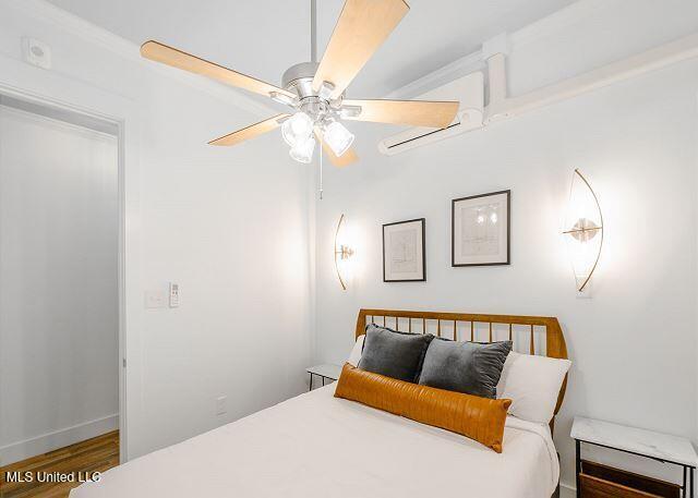 bedroom featuring ceiling fan and hardwood / wood-style floors