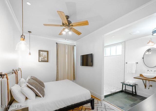 bedroom featuring crown molding, ceiling fan, and hardwood / wood-style flooring