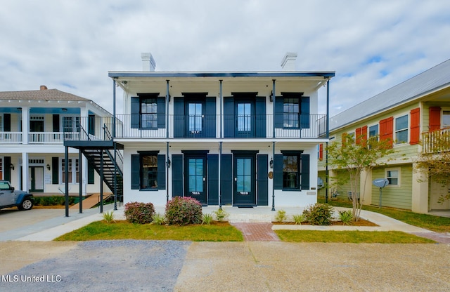 view of front of house with a balcony