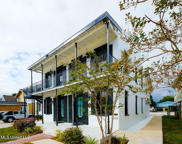 exterior space featuring a balcony