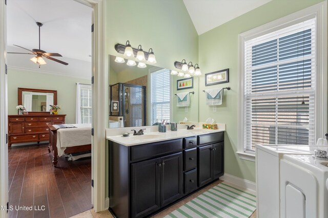 bathroom with vanity, an enclosed shower, a healthy amount of sunlight, and hardwood / wood-style flooring