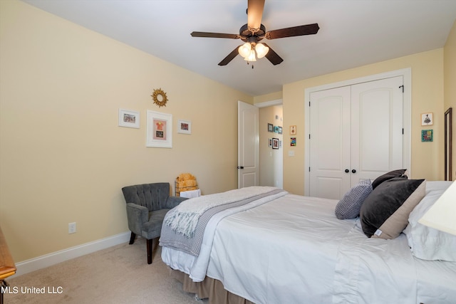 carpeted bedroom with a closet and ceiling fan