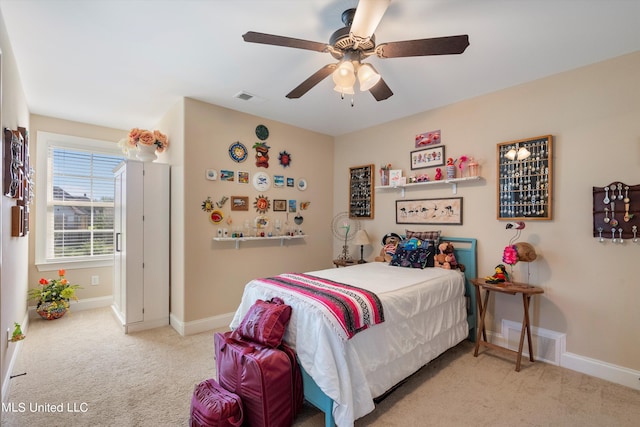 carpeted bedroom featuring ceiling fan