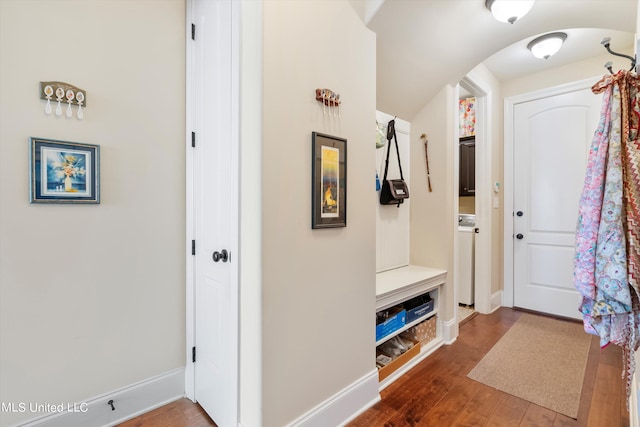 mudroom featuring hardwood / wood-style flooring and washer / clothes dryer