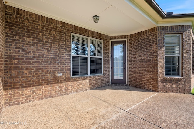 entrance to property with a patio