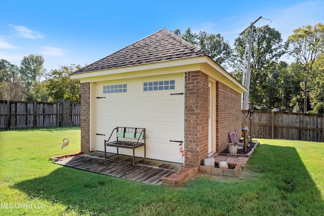 garage featuring a lawn