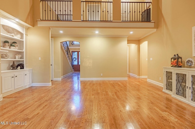 unfurnished living room featuring light wood-type flooring