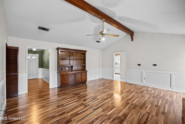 unfurnished living room featuring lofted ceiling with beams, dark wood-type flooring, and ceiling fan