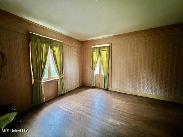empty room with wood finished floors