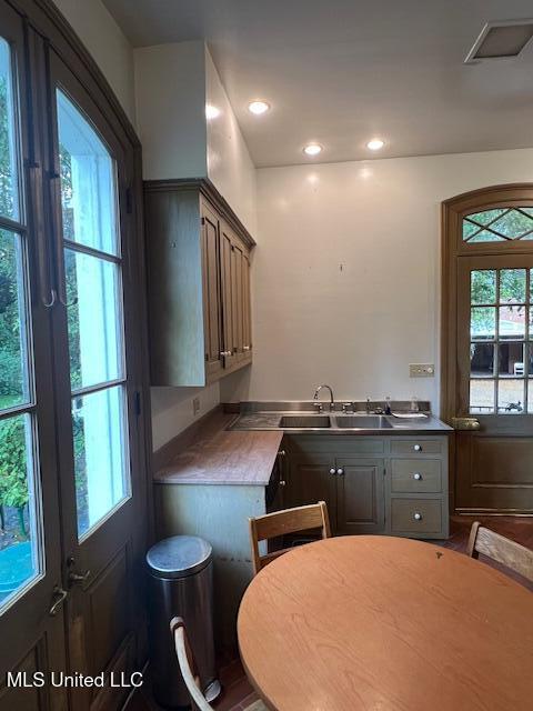 kitchen with recessed lighting, a sink, and visible vents
