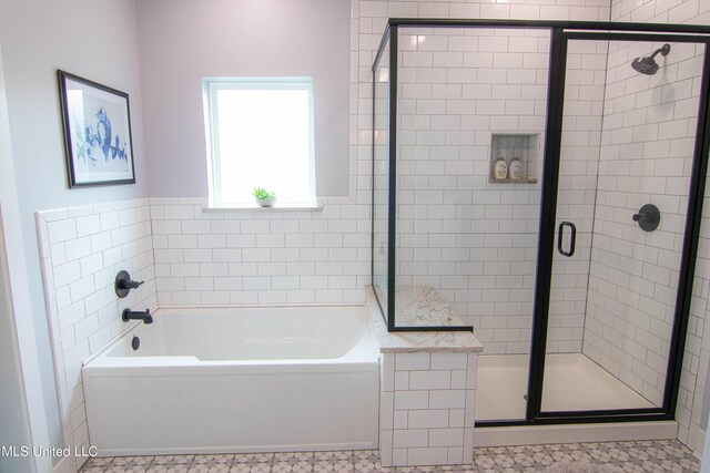 bathroom featuring separate shower and tub and tile patterned flooring