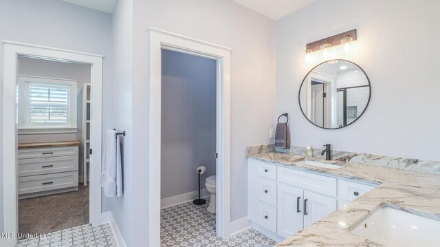 bathroom with vanity and toilet