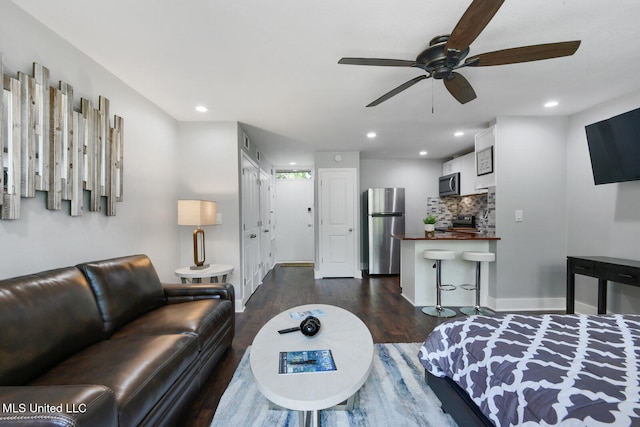 123A Lakeside Villa Dr Unit C, Diamondhead, MS 39525 - living room featuring baseboards, recessed lighting, a ceiling fan, and dark wood finished floors