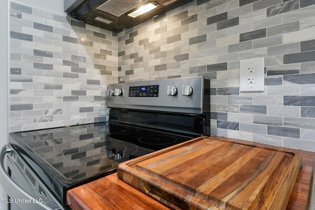123A Lakeside Villa Dr Unit C, Diamondhead, MS 39525 - interior details featuring range hood, tasteful backsplash, and stainless steel range with electric stovetop