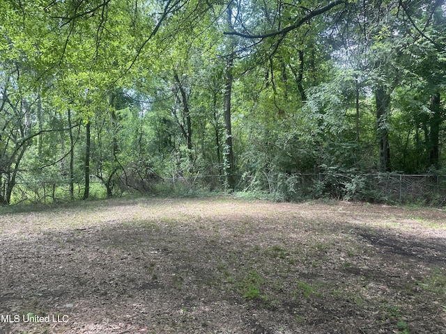 exterior space with a forest view