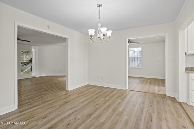 122 Carroll Ave, Long Beach, MS 39560 - unfurnished dining area with a ceiling fan, ornamental molding, a chandelier, and light wood-style flooring