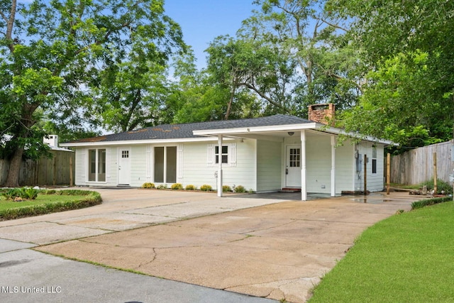 122 Carroll Ave, Long Beach, MS 39560 - view of front facade featuring concrete driveway and a chimney